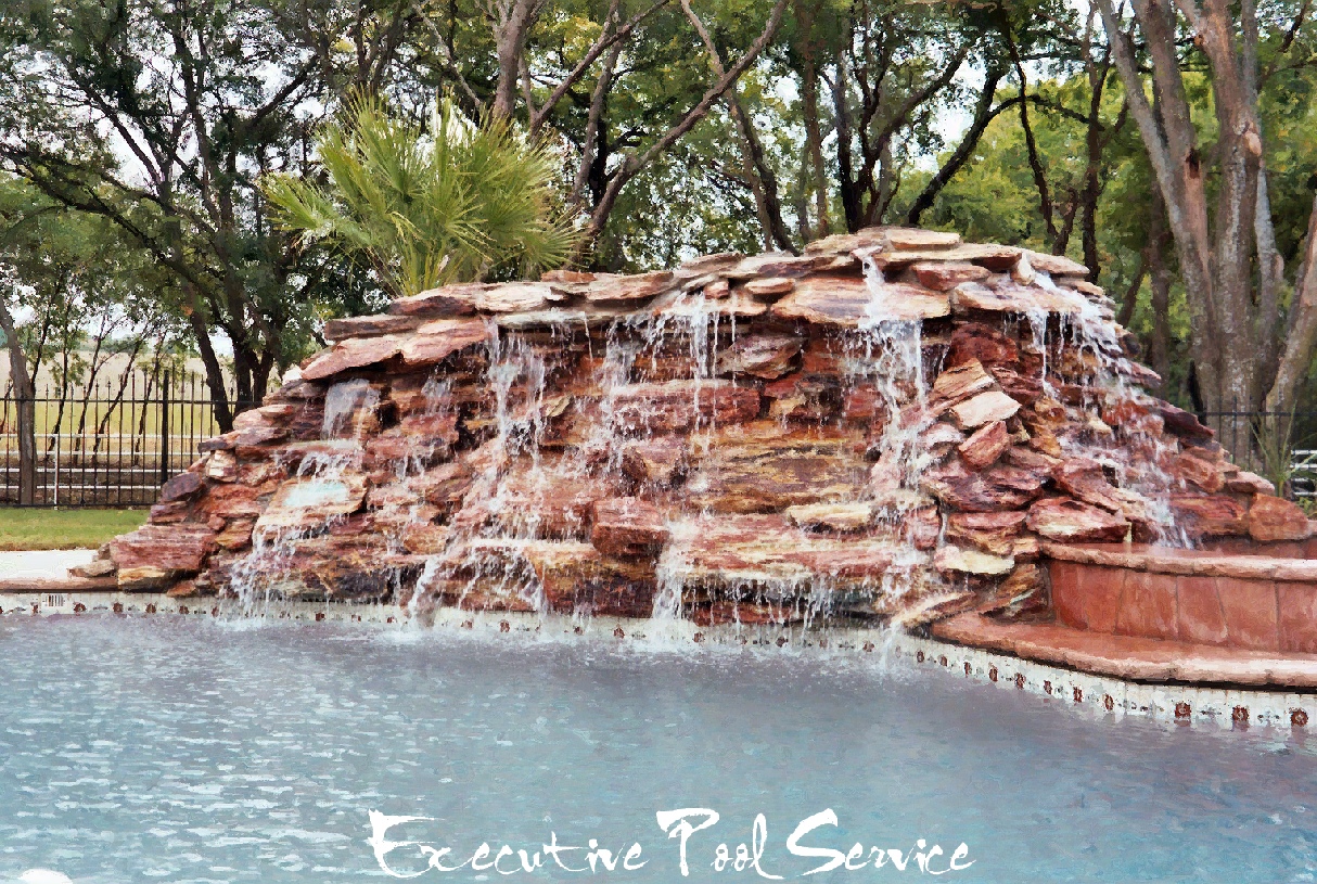 photo of rock waterfall and all rock spa built by Mark DeVelde with Executive Pool Service