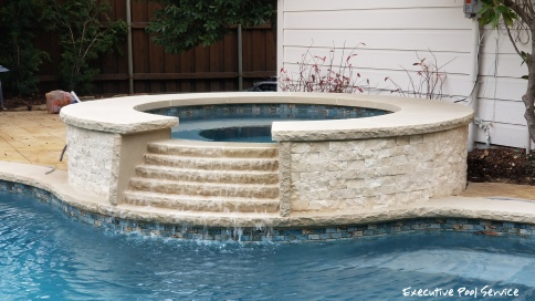 photo of pool spa renovation by Executive Pool Service McKinney, Texas (leuders light coping, ivory ledgestone & re-tile